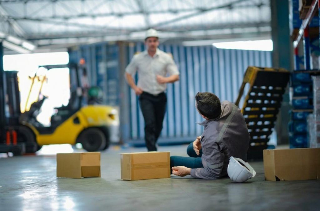 worker rushing to help fallen worker